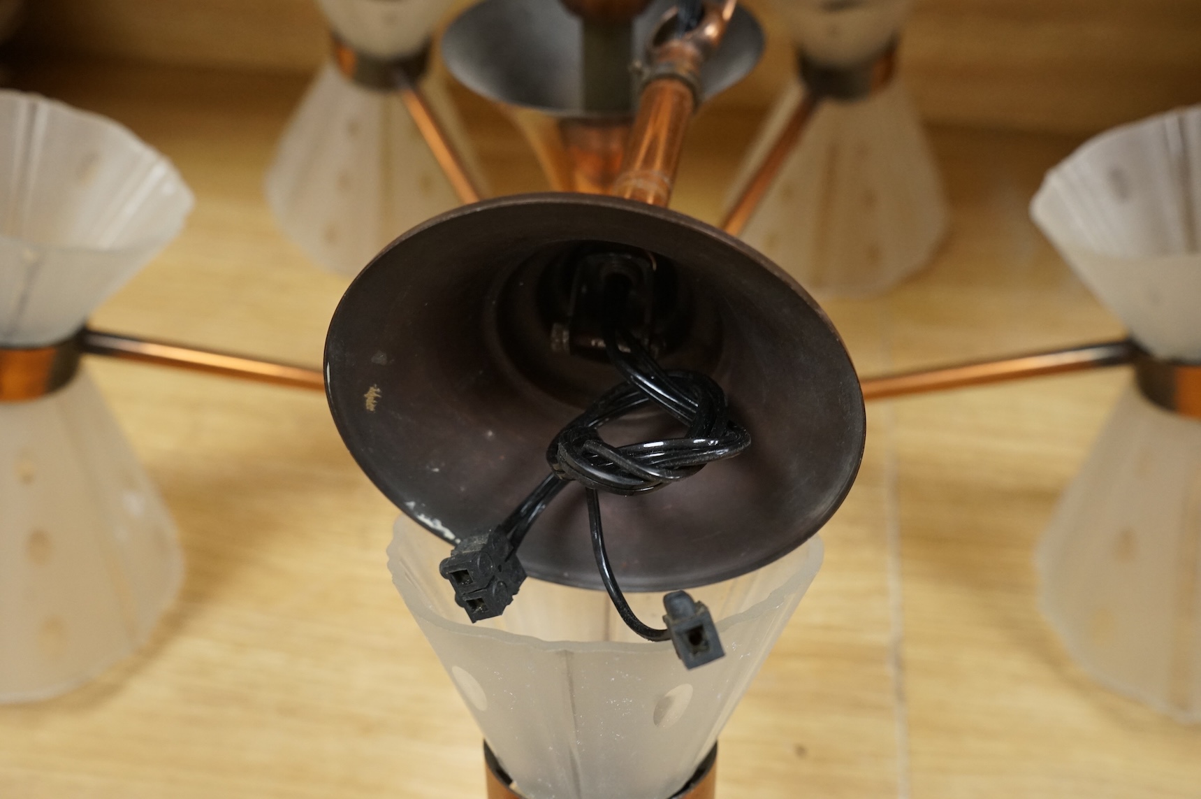 An oxidised copper five branch electrolier, 70cm wide